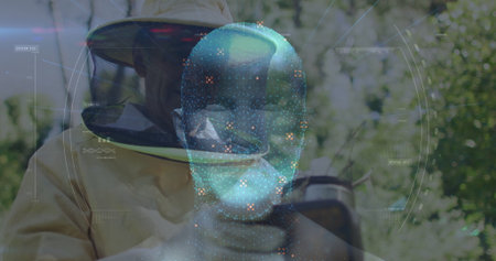 Examining beekeeper wearing suit and gloves observing hive frame in grove, with AR hologram....