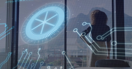 Observing businesswoman standing at office window with circular chart, circuit lines, copy space. Technology, innovation, skyline, professional, modern, data visualization, corporateの写真素材