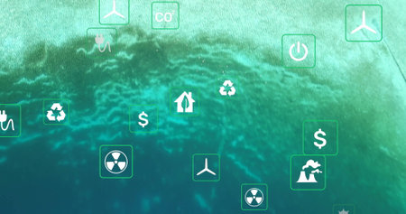 Displaying icons over green backdrop with recycling, wind turbine and energy symbols. Environment, sustainability, renewable, innovation, eco-friendly, technology, conservationの写真素材