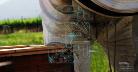 Beekeeper in suit and veil leaning over beehive box in apiary with padlock graphic, copy space. Apiary, sustainable, protective, digital, security, horticulture, natureの写真素材