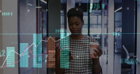 Viewing smartphone woman in dress holding coffee cup in office corridor, with financial charts. Professional, corporate, stylish, modern, digital, analytics, businesswomanの写真素材