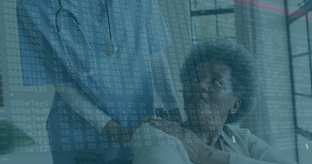 Examining binary data overlay senior woman in wheelchair and adult daughter collaborating in office. Disability, mentorship, technology, accessibility, innovation, teamwork, professionalの写真素材