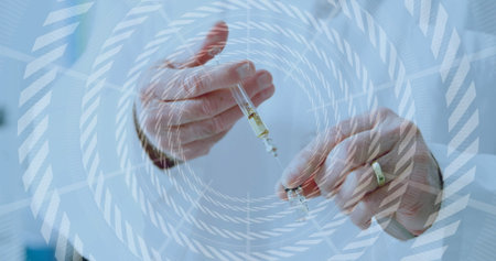 Doctor's hands drawing clear liquid into syringe in lab, with vial, lab coat cuff, digital overlay. Medical, healthcare, innovation, precision, technology, science, professionalismの写真素材