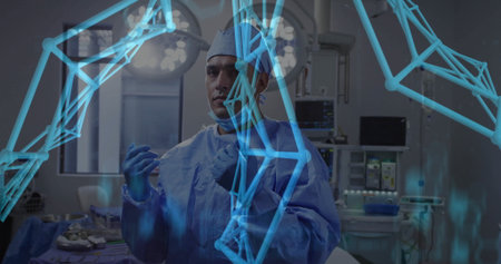 Standing surgeon wearing blue scrubs at operating room, with lights and digital overlay graphics. Medic, healthcare, digital, futuristic, precision, innovation, professionalismの写真素材