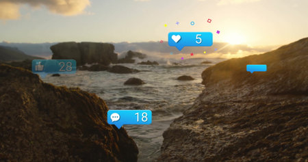 Displaying blue social media icons over rugged coastal channel at sunset, with wave reflections....