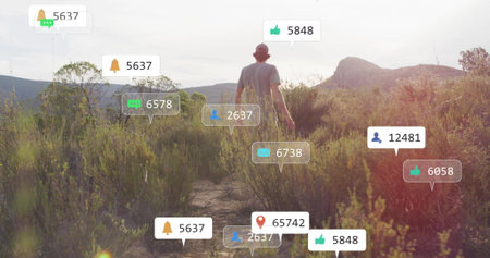Hiking man in t-shirt shorts and cap navigating path through scrubland, with notification bubbles....