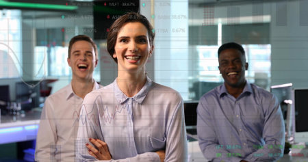 Standing professionals wearing business attire smiling in office with monitors, data chart overlay....