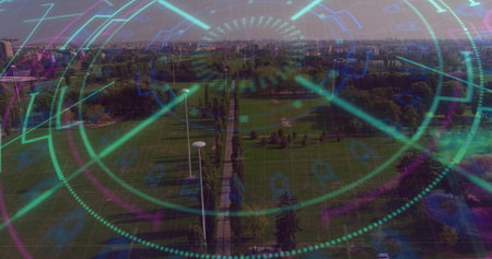 Overlaying HUD graphics across aerial park promenade, with lamp posts, trees and skyline. Urban,...