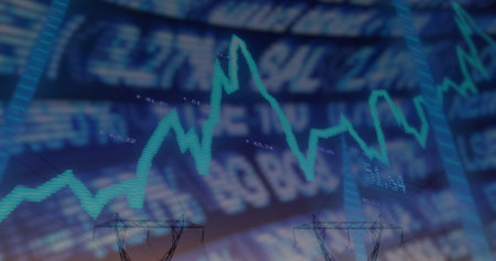 Displaying green fluctuating line chart with numeric ticker on screen and power tower silhouettes....