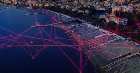 Showing rows of beach umbrellas and loungers lining sandy beach, with network overlay, copy space. Coastal, relaxation, leisure, scenic, modern, technology, tourismの写真素材