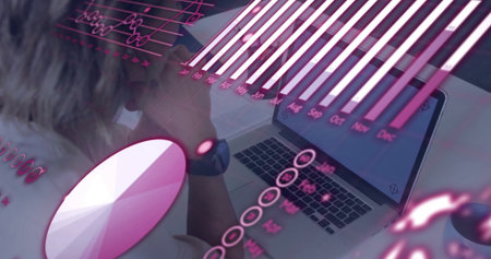 Analyst reviewing floating chart overlays on laptops at office desk with smartwatch, copy space....