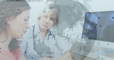 Consulting physician wearing white coat reviewing patient chart in exam room with globe overlay....