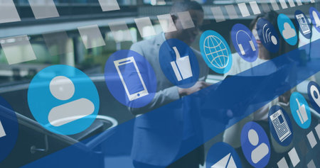 Leaning executives examining device screens near glass escalator railing, with floating icons....