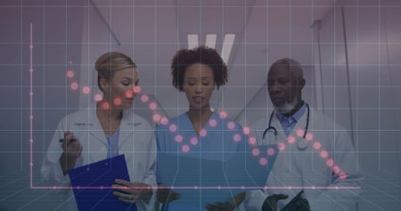 Reviewing patient data, doctors and nurse in hospital corridor, with charts, digital graph overlay. Medical staff, healthcare, clinical, professionalism, diagnostics, wellness, futuristicの写真素材