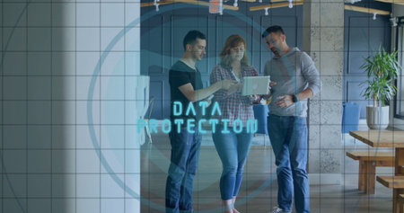 Analyzing data protection overlay on silver laptop by three professionals at wood table, with plant....