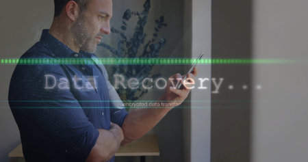 Reviewing smartphone Data Recovery overlay in office by wooden table, copy space. Technology,...