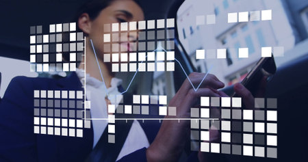 Business professional reviewing smartphone data overlay in train carriage, with blue line graph. Corporate, technology, modern, analysis, commuter, urban, digitalの写真素材