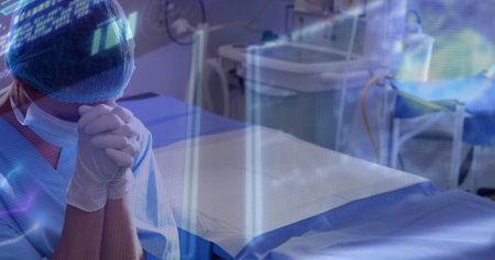 Standing surgeon in operating room monitoring holographic data beside operating table, copy space....