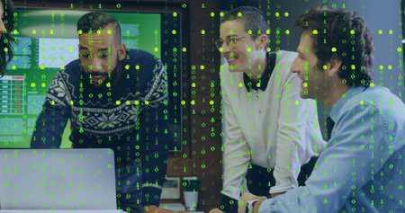 Leaning team in office using laptop, displaying binary code overlay with monitors and coffee cup....