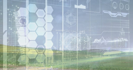 Displaying holographic interface over rural grass field, with hexagon panels and schematics. Futuristic, immersive, visualization, technology, innovation, digital, landscapeの写真素材