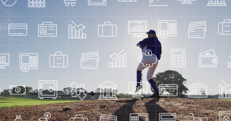 Winding up pitcher wearing uniform and glove on mound at baseball field, with financial icons. Athletic, teamwork, competitive, vibrant, occupational, dynamic, outdoorの写真素材
