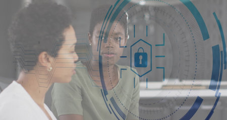 Two women in office attire analyzing security HUD in office, with lock icon, circular interface....