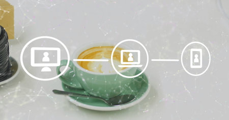 Displaying green coffee cup resting on saucer on white desk, with metal spoon, lens, network icons. Minimalist, modern, technology, communication, workspace, freshness, connectivityの写真素材