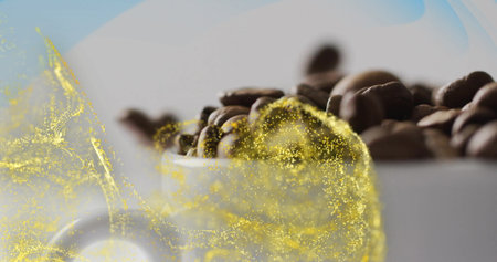 Showcasing white ceramic cup holding roasted coffee beans in studio, with golden particle swirl. Artisanal, elegance, luxury, warmth, craft, aroma, hospitalityの写真素材