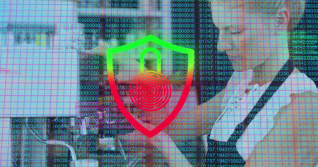 Displaying business professionals analyzing code overlay in office, with laptop and shield icon....