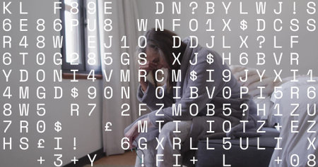 Sitting woman in gray pajamas resting head on hand on bed in bedroom, with feet bare. Contemplation, serenity, repose, minimalism, aging, comfort, domesticの写真素材