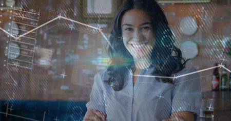 Standing woman wearing button-up blouse crossing arms in modern lounge, with floating data charts. Professional, analytics, contemporary, workspace, innovation, interior, corporateの写真素材