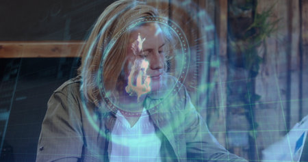Analyzing man in overshirt reviewing document at studio desk, with floating holographic interface. Futuristic, technology, innovation, workspace, analytics, digital, modernの写真素材