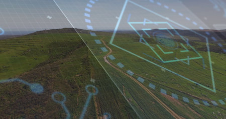Displaying aerial view showing grassland hills over countryside, with HUD overlay and winding track....