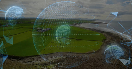 Hovering holographic sphere showing data globes above coast, with grazing herd and pasture fences....
