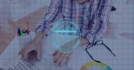 Typing male wearing striped shirt on laptop at desk, with biometric overlay, color wheel chart....