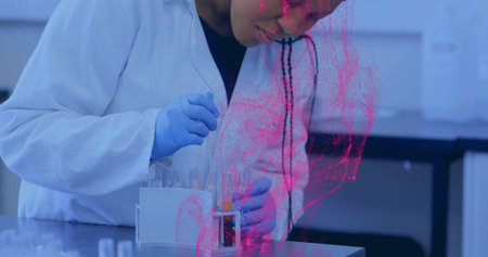 Pipetting woman in lab coat, gloves filling tubes in test tube rack in laboratory. Scientist, research, experimentation, analytical, precision, innovation, scientificの写真素材