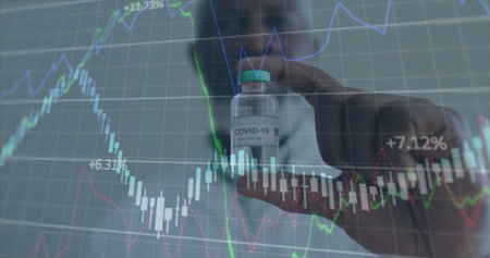 Displaying researcher in lab coat holding COVID-19 Injection vial in lab, with financial graphs....