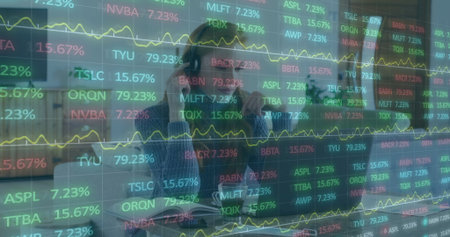Analyzing woman reviewing tickers on transparent screen in office with eyeglasses  and  laptop....