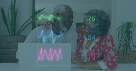 Smiling mature couple resting hand on shoulder using laptop in living room, with vital-sign overlay. Elderly, companionship, health monitoring, cozy, modern, wellness, connectionの写真素材