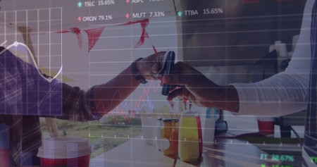 Completing payment two men tapping smartphone on terminal in cafÃ©, with juice bottles and apron. Technology, transaction, hospitality, casual, modern, outdoor, freshnessの写真素材