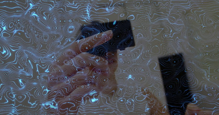 Holding smartphone, woman's hand interacting with screen in home office with contour overlay....
