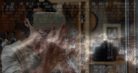 Gesturing adult male wearing VR headset using hand tracking in home studio, guitars, coding overlay. Technology, innovation, digital, immersive, creative, modern, entertainmentの写真素材