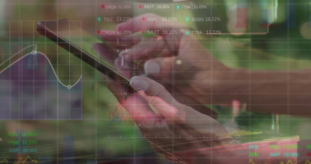 Showing hands holding smartphone at digital workspace, with ticker, line chart and grid overlays. Technology, finance, analytics, innovation, data visualization, digital, workspaceの写真素材