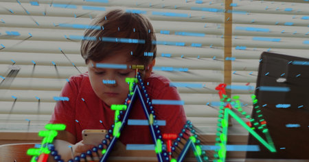 Sitting boy wearing red shirt holding smartphone at wooden table, with laptop, floating data charts....