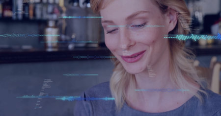 Sitting woman wearing grey top interacting with digital overlays at cafÃ© counter, copy space. Modern, technology, casual, relaxed, urban, digital, socialの写真素材