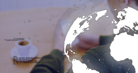 Developer forearms using touchscreen device in workspace with coffee cup, code and globe overlay....