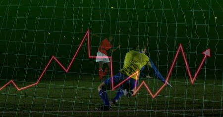 Diving yellow goalie saving ball from red jersey player at night field with net analytics overlay. Athletic, competition, strategy, focus, dynamic, adrenaline, sportsの写真素材
