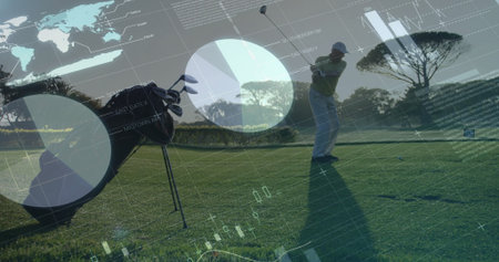 Standing golfer in golf attire swinging club on fairway beside golf bag, with digital infographics. Sports, leisure, outdoor, fitness, technology, analytics, healthの写真素材