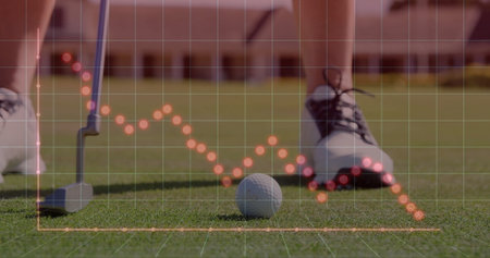 Resting golf ball showing orange dotted grid overlay near putter head, golf shoes on putting green. Sports, recreation, athletic, precision, outdoor, competitive, leisureの写真素材