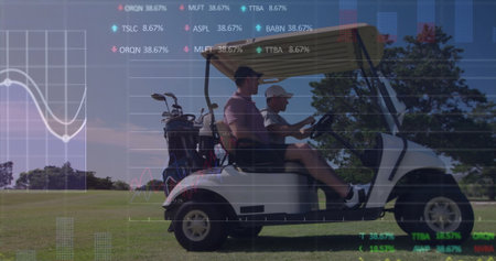 Riding golf partners cruising cart on fairway in polos and caps, with club bags, digital charts. Luxury, leisure, outdoor, sport, technology, collaboration, activityの写真素材